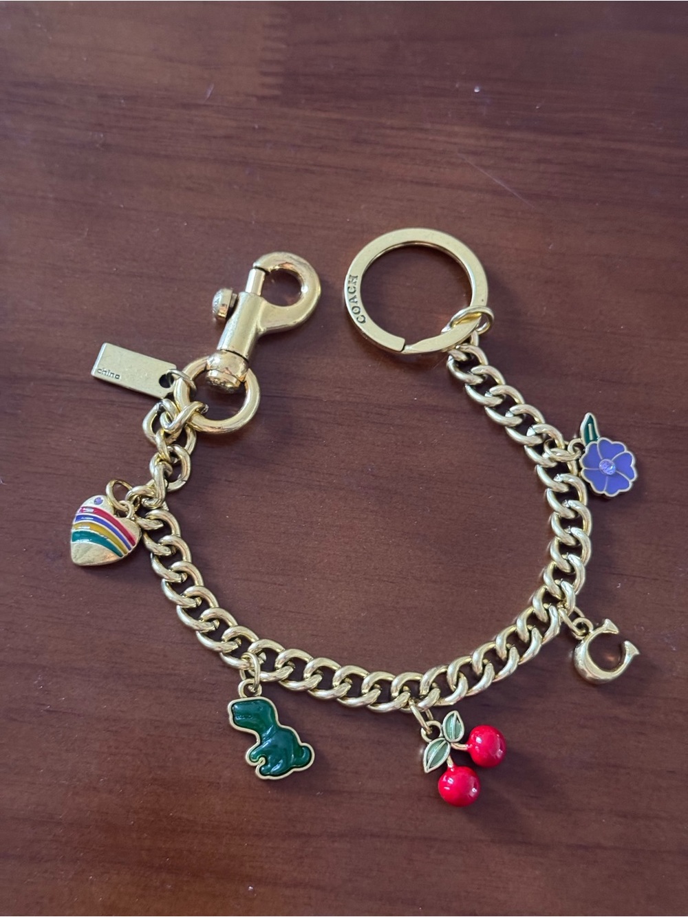 Coach Gold-Tone Charm Keychain with Red, Green, Purple, Yellow Accents